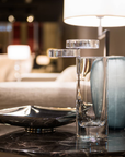 Mario Cioni A.Y.L.I. Cilindric Clear Crystal Vase by Tondo Doni on a coffee table with a bowl & Vase in an interior available at spacio india for luxury home decor collection of decorative vases.