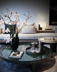 Mario Cioni Crystal Green Liquid Mood Vase by Tondo Doni on a centre coffee table with other home accessories & luxury furniture available at Spacio India for luxury home decor accessories collection of decorative Vases
