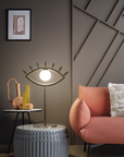 An imagination-evoking living room with the Eye shaped table lamp from Masiero Visio Collection couch and a surrealist lamp, featuring uniquely crafted facial geometries. Styled by Spacio Interior Styling team