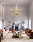 An ornate grade chandelier in a double height living room from Masiero, available at Spacio in India.