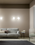 A living room showcasing the simplicity of Masiero Posy Collection, beige walls and a grey couch, creating a balanced ambiance. Styled by Spacio Interior Styling team