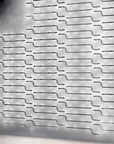 Decorative modular wall lights with wavy pattern on a gray background