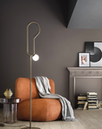 A surrealist living room with a Masiero Visio Collection - Ear Floor Lamp styled by Spacio Interior Styling Team