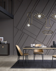 A surrealist dining room that sparks imagination with its black walls, exhibiting facial geometries, and furnished with Masiero Visio Collection