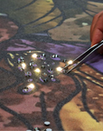 Close-up view showing artisan hand-placing crystals and LEDs on Meystyle Dreams Boutique luxury wallpaper, highlighting detailed craftsmanship, available at Spacio India.