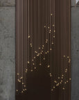 Meystyle Illusion of Entropy Infinity LED Crystal wall covering on a grey rustic wall. Availabel at Spacio in India