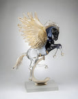 Glass sculpture of a Pegasus on a gray background from Murano studio available at Spacio retail store in Mumbai.