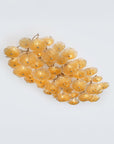 Cluster of yellow glass lights on a white background