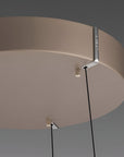 Ceiling kinetic light fixture with a neutral background