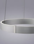 Modern pendant kinetic light with a minimalist design on a gray background
