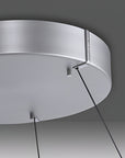 Close-up of a modern kinetic chandelier with a dark background