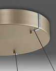 Close-up of a beige kinetic light fixture with black cables on a gray background