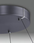 Ceiling kinetic light fixture with dark gray finish on a neutral background