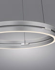 Modern Kinetic ring light fixture on a gray background