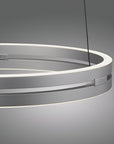 Modern pendant kinetic light with circular design on a gray background