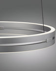 Modern pendant kinetic light with circular design on a gray background