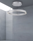 Modern ceiling kinetic light fixture in a gray room