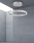 Modern ceiling kinetic light fixture in a gray room