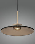 Modern kinetic pendant light with a dark glass shade on a gray background from Neuhaus Pure available at Spacio in India.