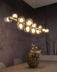 Modern Kinetic chandelier with multiple lights in a room setting