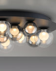 Ceiling light fixture with multiple bulbs on a neutral background