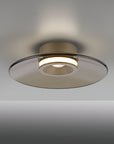 Modern ceiling light fixture with glass shade on a gradient background
