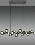 Modern kinetic pendant light fixture with multiple bulbs on a gray background