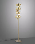 Modern floor lamp with multiple spherical lights on a gray background
