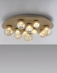 Ceiling light fixture with multiple round bulbs on a plain background