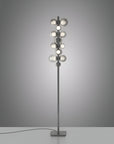 Modern floor lamp with multiple light bulbs on a gray background