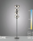 Modern floor lamp with LED indicator on a gray background