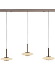 Modern pendant light fixture with three hanging lights on a white background