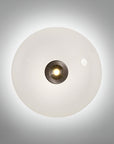 Round wall light fixture with a white glass cover on a gray background