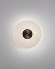 Round wall light fixture with a white glass cover and dark metal fixture on a gray background