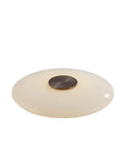 Round table lamp with a beige glass shade and bronze metal fixture on a white background