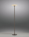 Floor lamp with a white shade on a gray background