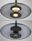 Modern pendant light with glass shades on a neutral background