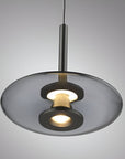 Modern pendant light with a gray glass shade on a gray background