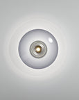 Round ceiling light fixture on a gray background