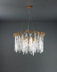 Chandelier with gold frame and clear glass elements on a dark gray background