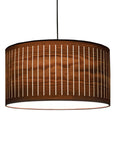 Wooden pendant lamp with a cylindrical design on a white background from Nomon available at Spacio retail stores in Mumbai & Kolkata.