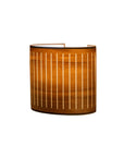 Wooden wall lamp on a white background from Nomon available at Spacio retail stores in Mumbai & Kolkata.
