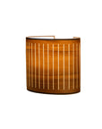 Wooden wall lamp on a white background from Nomon available at Spacio retail stores in Mumbai & Kolkata.