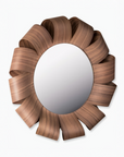 Wooden wall mirror with a decorative frame on a white background