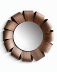 Decorative wall mirror with a brown, ribbon-like frame on a white background