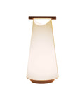 Modern table lamp with a white shade and wooden base on a white background from Nomon available at Spacio retail stores in Mumbai & Kolkata.