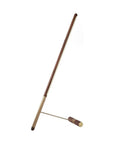 Brass & walnut wood floor lamp on a white background from Nomon available at Spacio retail stores in Mumbai & Kolkata.
