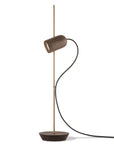 Modern floor lamp with a cylindrical shade on a white background from Nomon available at Spacio retail stores in India.