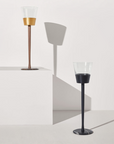 Two wine chillers on a white surface with a light gray background
