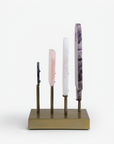 Side view of a table top sculpture with various coloured quartz.